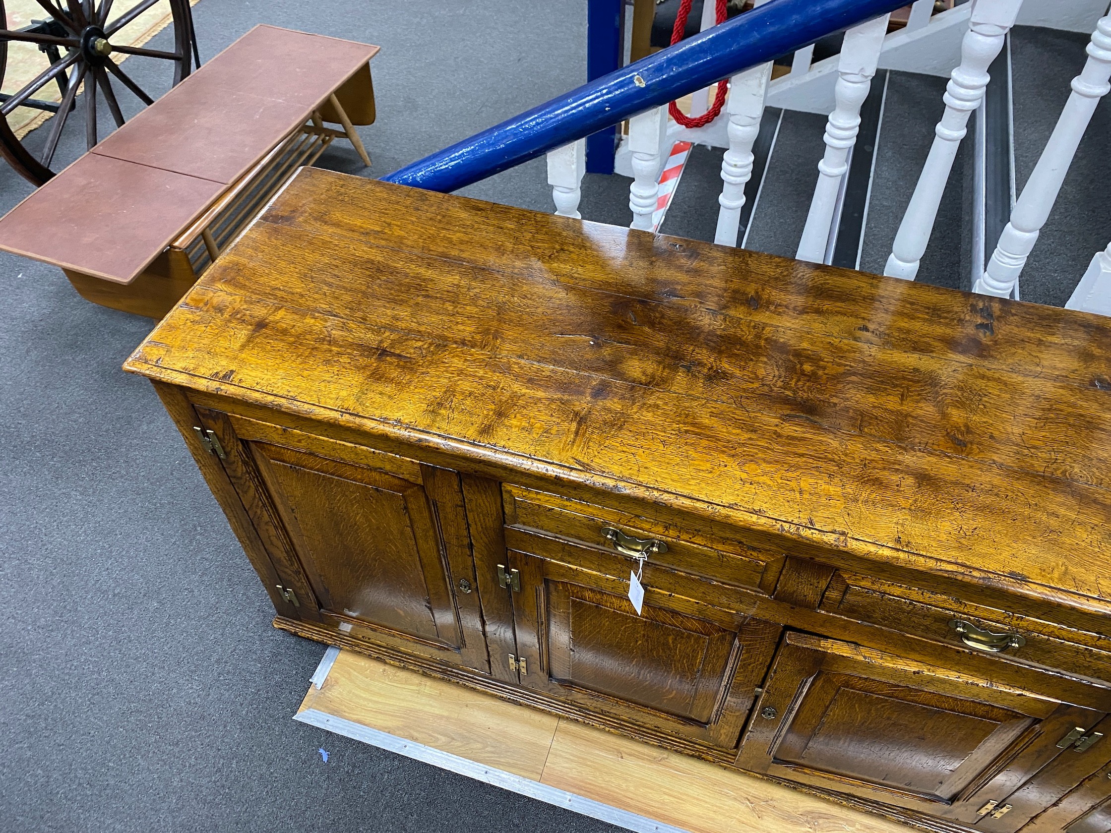 An 18th century style pale oak low dresser, length 190cm, depth 49cm, height 83cm